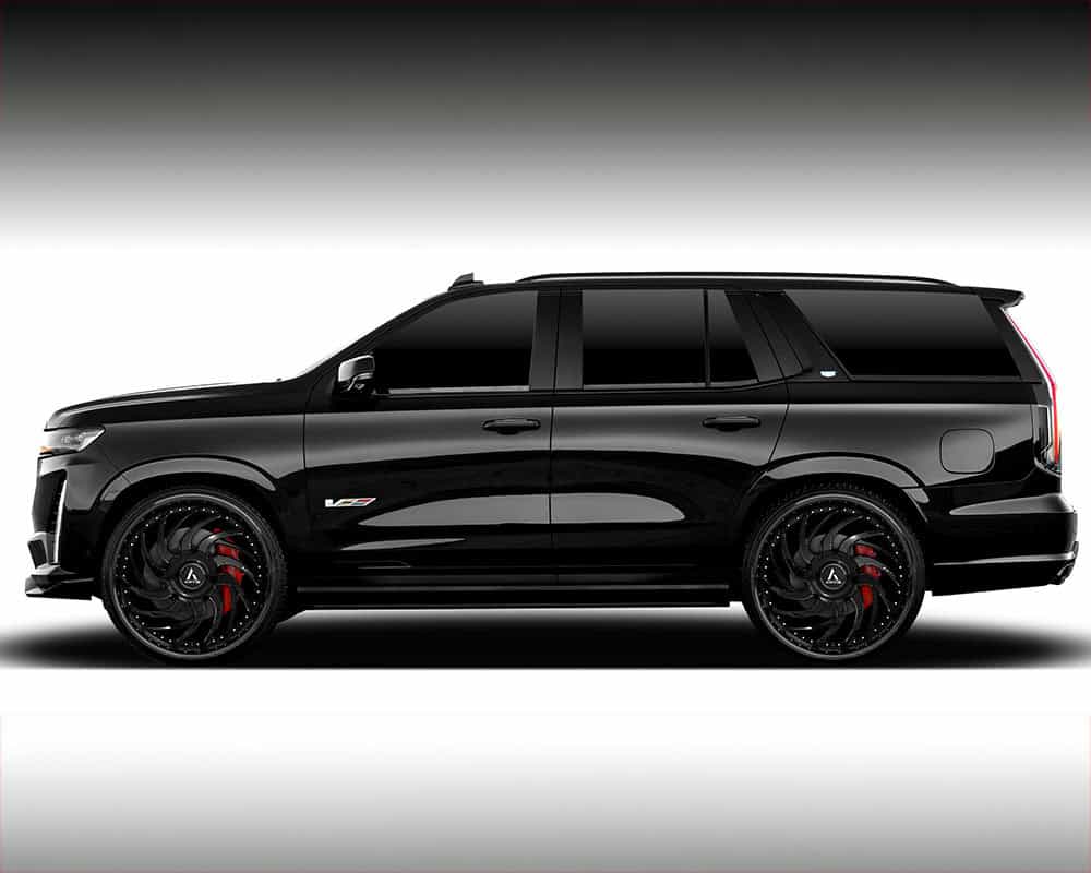 Luxury black SUV with custom wheels and sleek design.