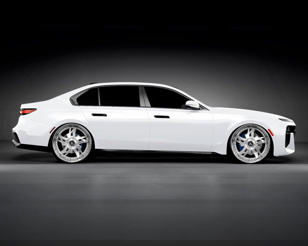 White luxury sedan with custom Lexani Laredo-XL wheels.