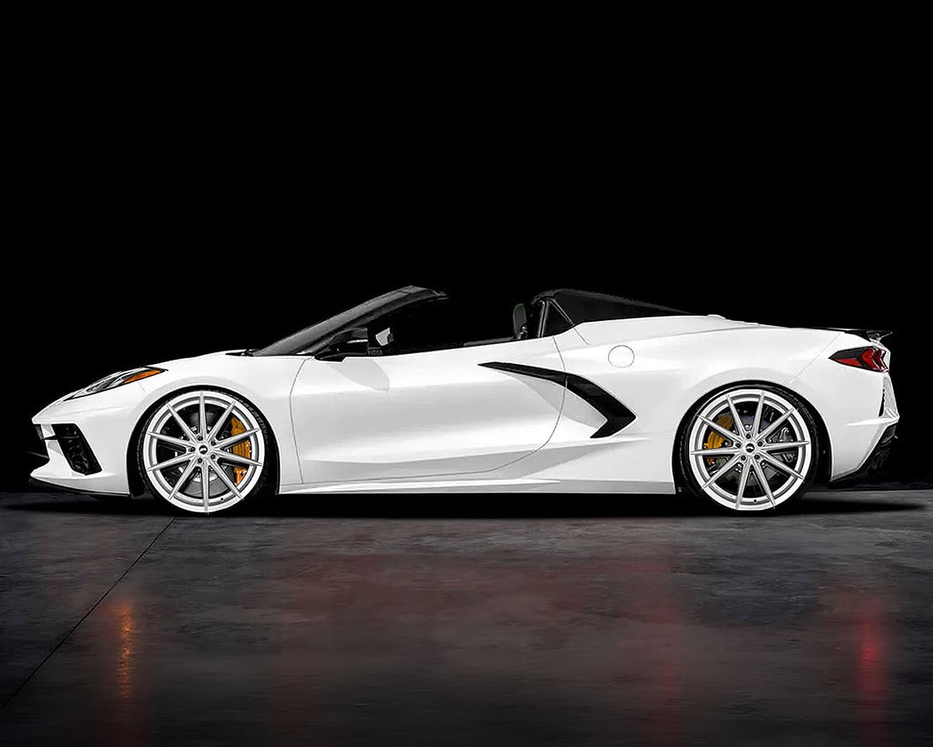 Luxury convertible sports car with custom wheels from Lexani.