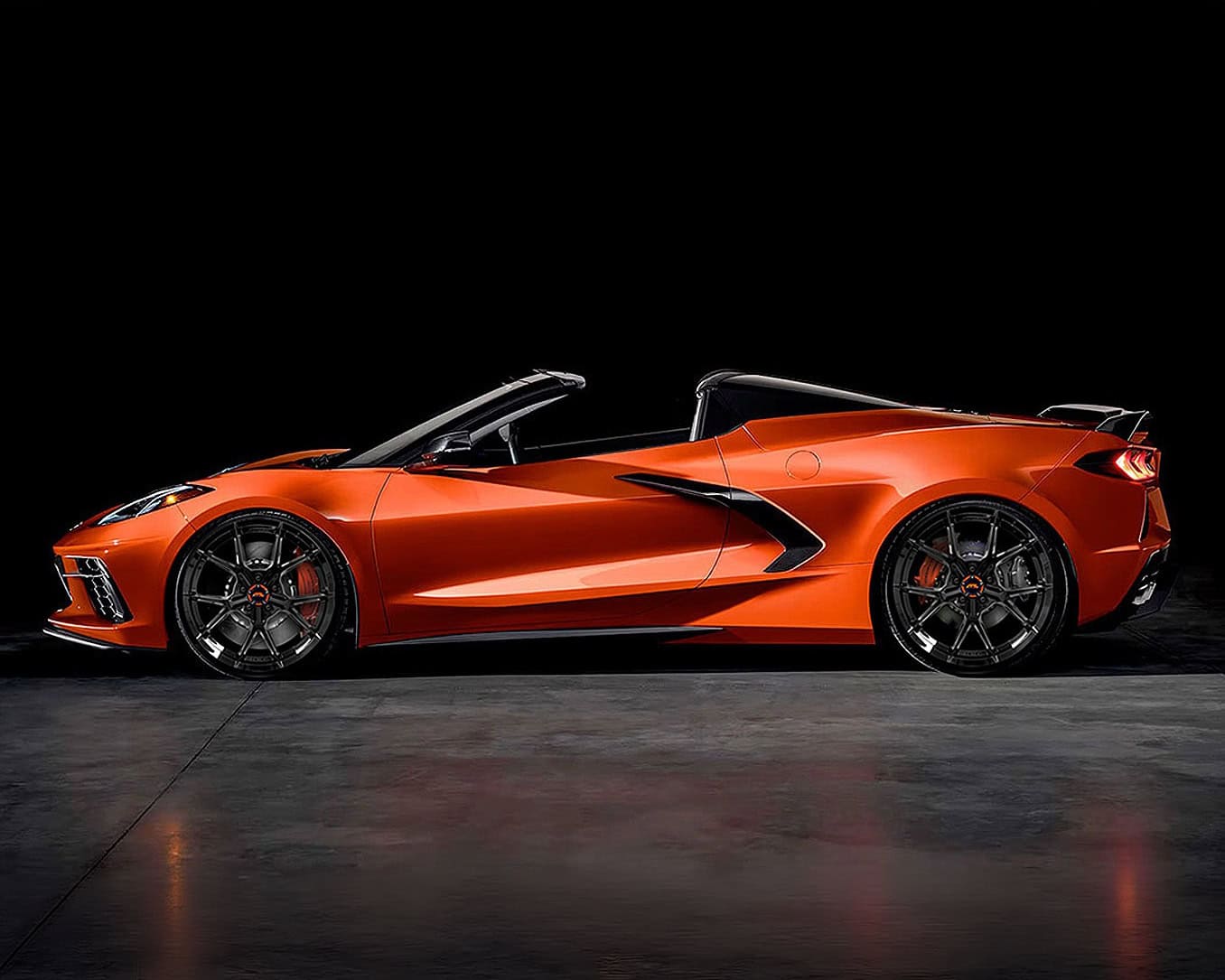 Orange Lamborghini RFL-05 convertible sports car with black wheels.