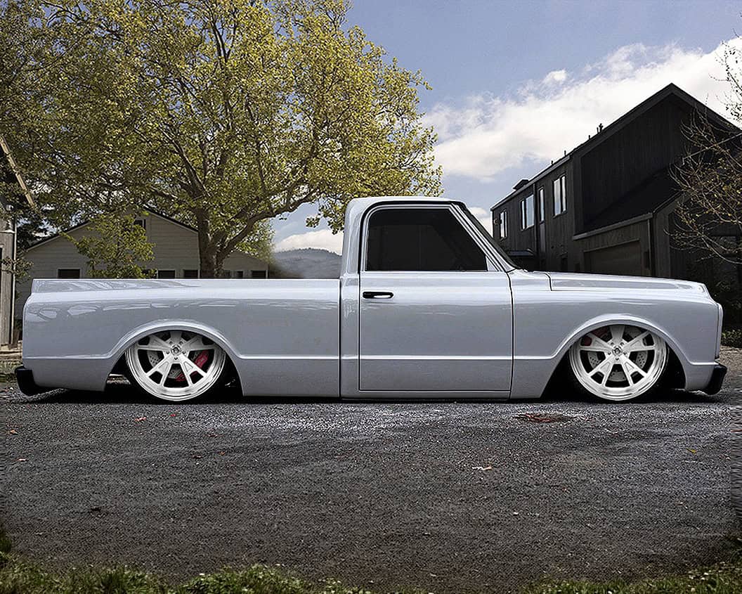 Custom Lexani Valkyrie truck with sleek silver finish and lowered stance.