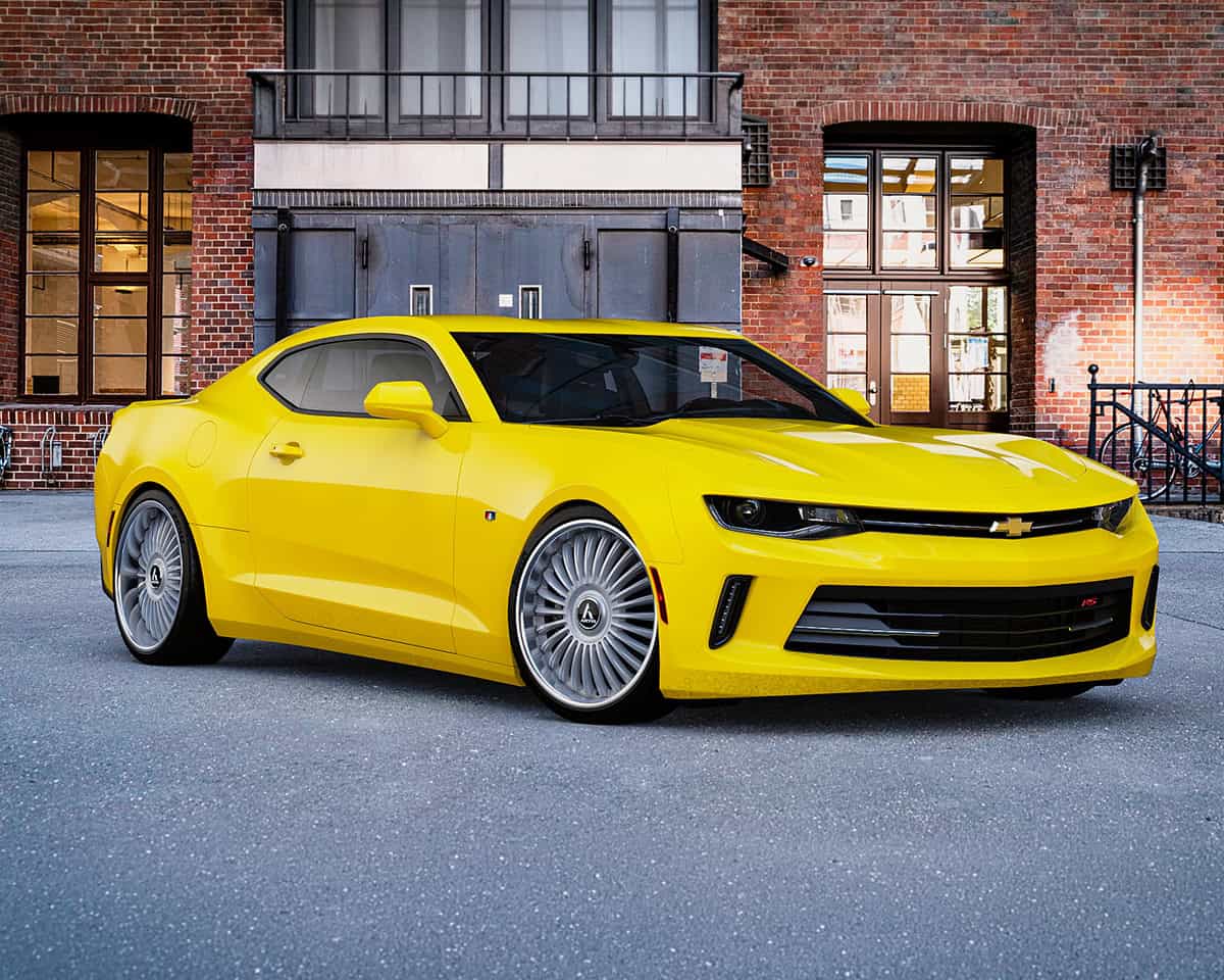 Custom yellow Chevrolet Camaro with Lexani Havana-XL wheels.